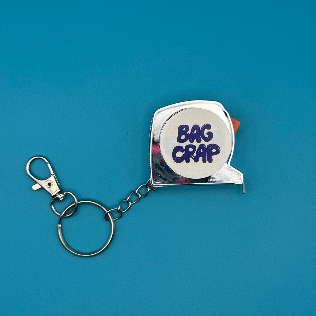 BAG CRAP Silver Plastic Measuring Tape Keychain