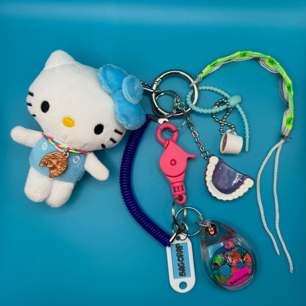 Vintage Blue Hello Kitty Plushie and Purple Plastic Teeth Keychain and Bag Charm Pack