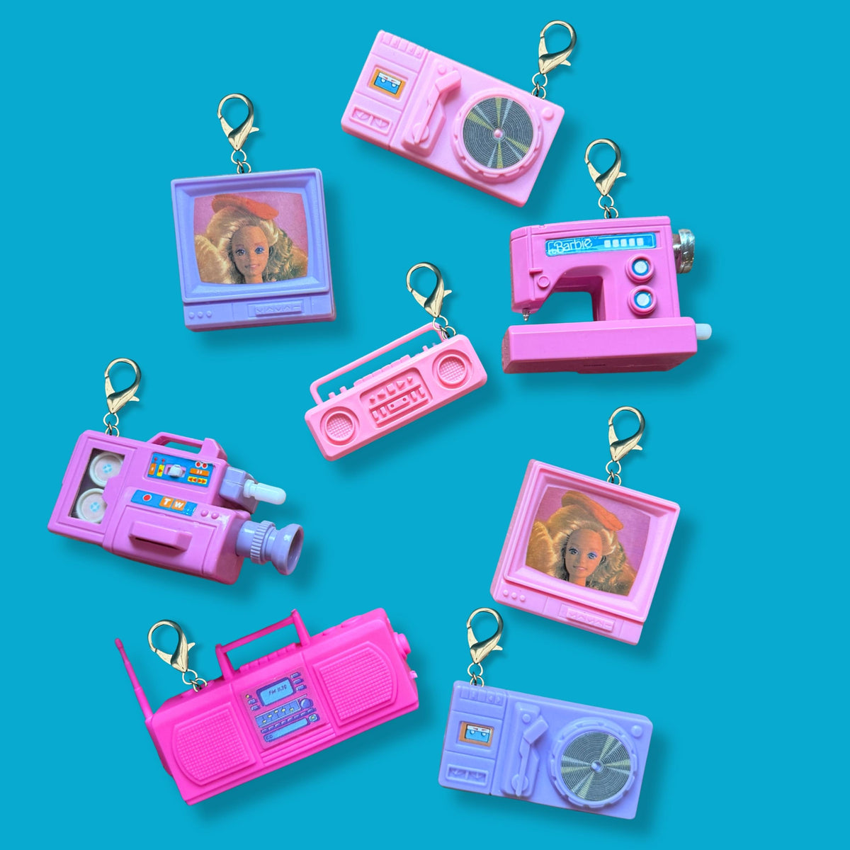 vintage Barbie toy keychains made from original 90s Barbie toys including boomboxes, turntables, TVs, wind up sewing machine, and wind up camcorder. 