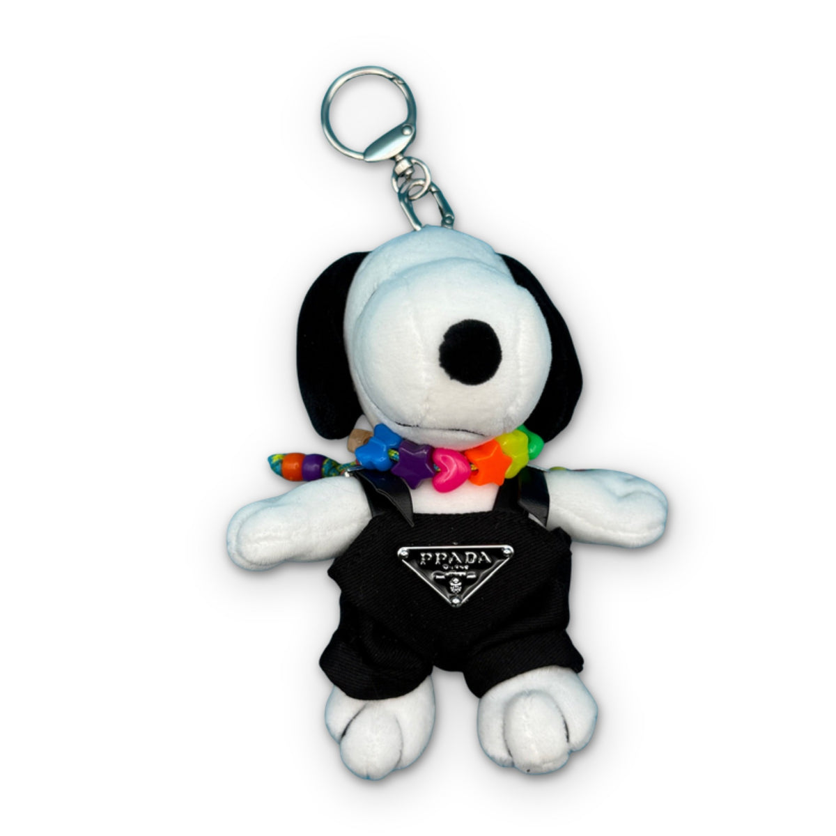 6-inch Snoopy Plush Bag Charm in 'Prada' Outfit + Colorful Beaded Necklace on a white background