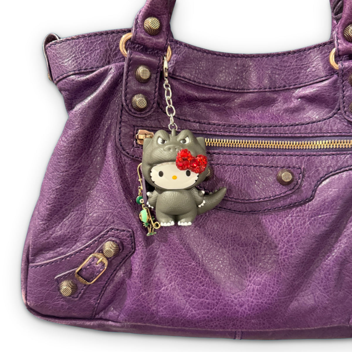 BEDAZZLED Hello Kitty Godzilla McDonald’s Happy Meal Charm on a white background