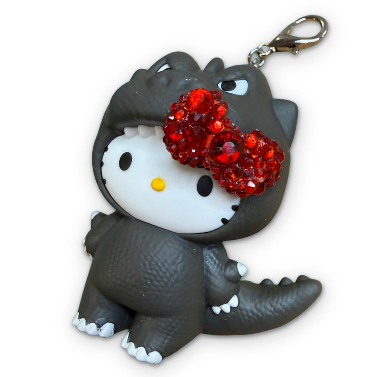 BEDAZZLED Hello Kitty Godzilla McDonald’s Happy Meal Charm on a white background