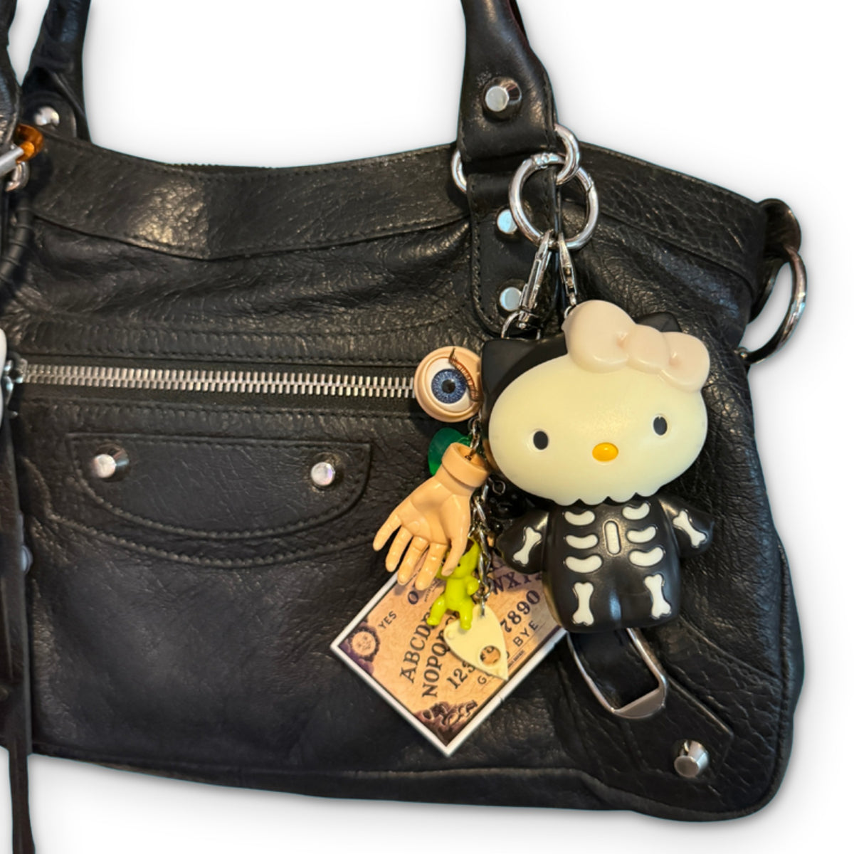 Halloween Hello Kitty Happy Meal Bag Charms on a white background