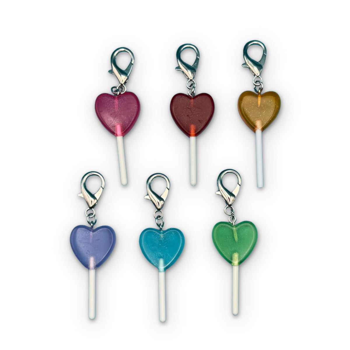 Heart Shaped Lollipop Candy Bag Charm Keychains on a white background