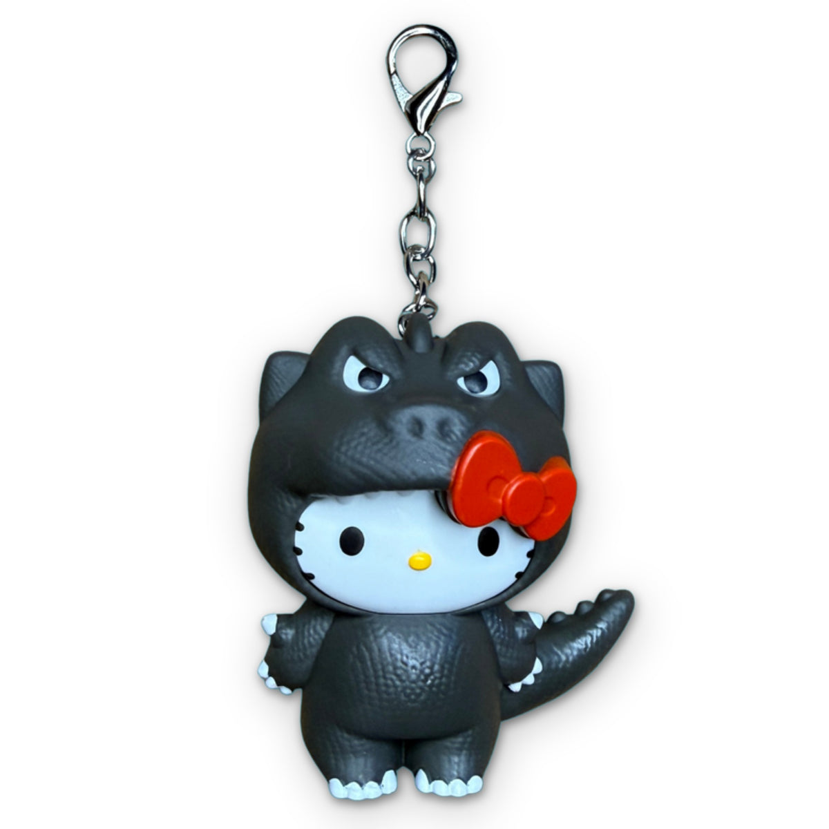 Hello Kitty Godzilla McDonald’s Happy Meal Charm on a white background