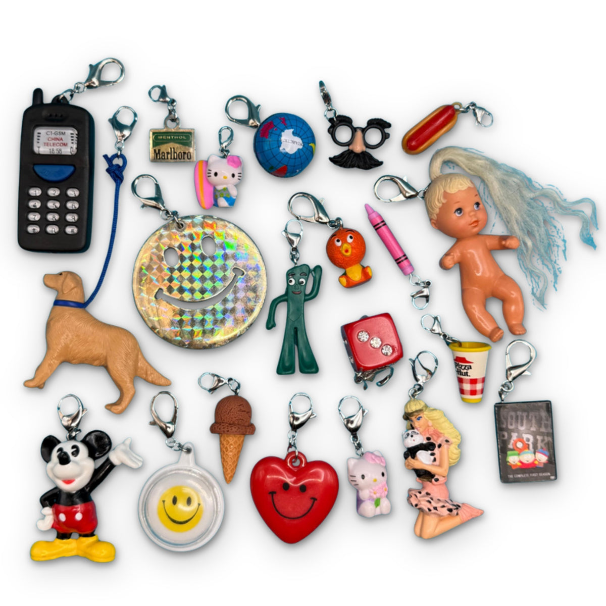 Junk Drawer Vintage Keychains & Mini Charm Collection on a white background