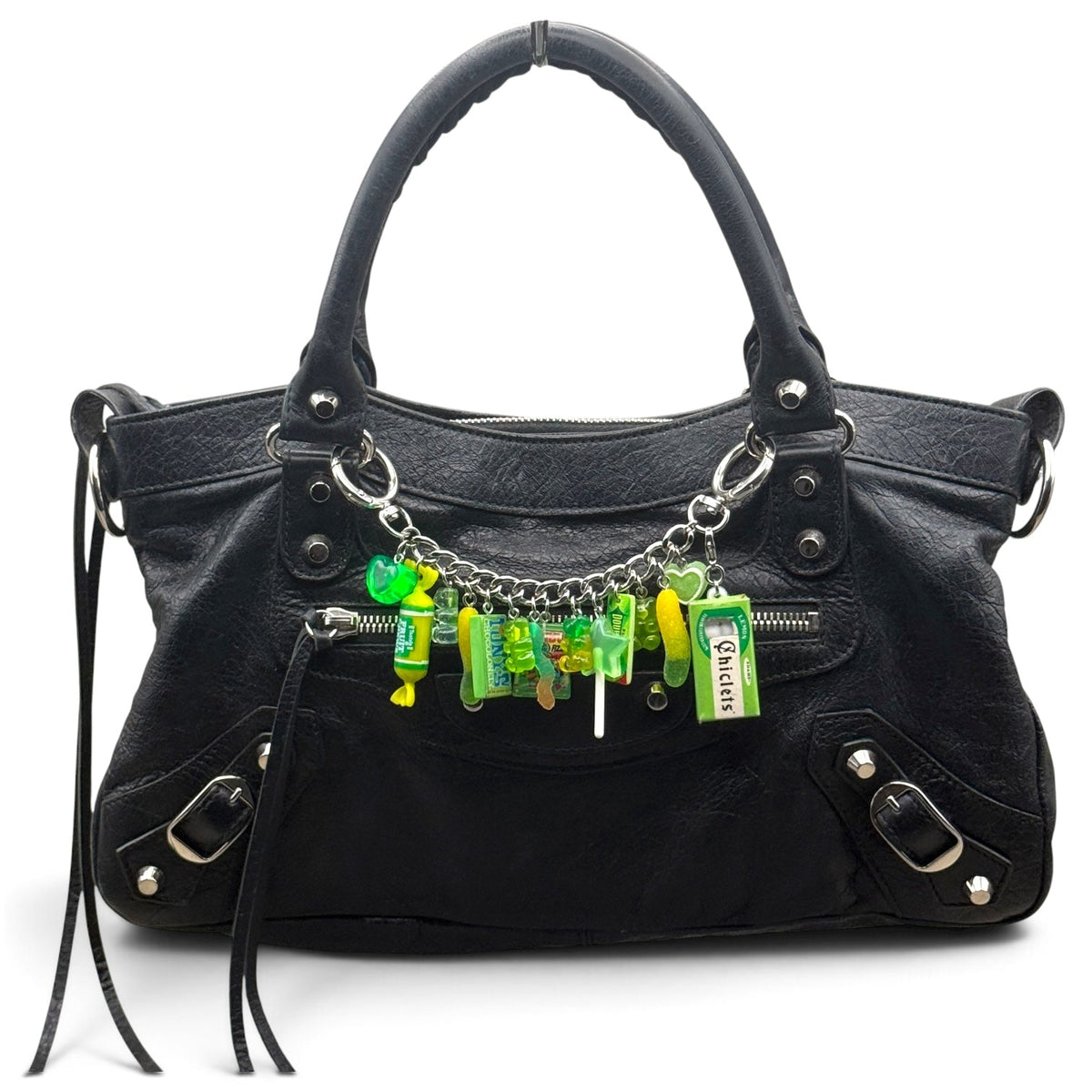 Lime green candy bag chain styled across a black handbag using its included end clasps, with miniature Chiclets, Junior Mints, Life Savers, gummy bears and lollipop charms.