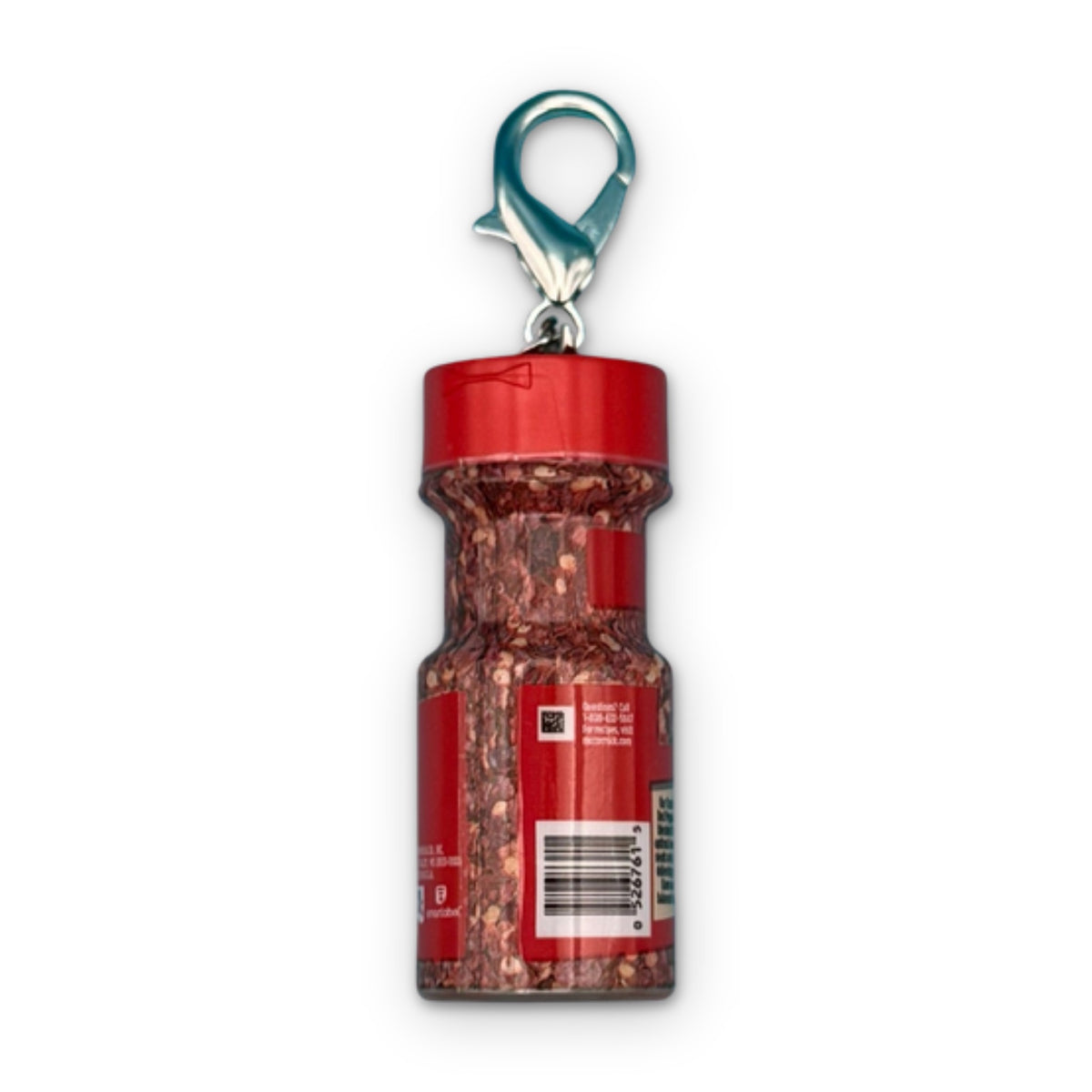 Mini McCormick Crushed Red Pepper Bag Charm on a white background