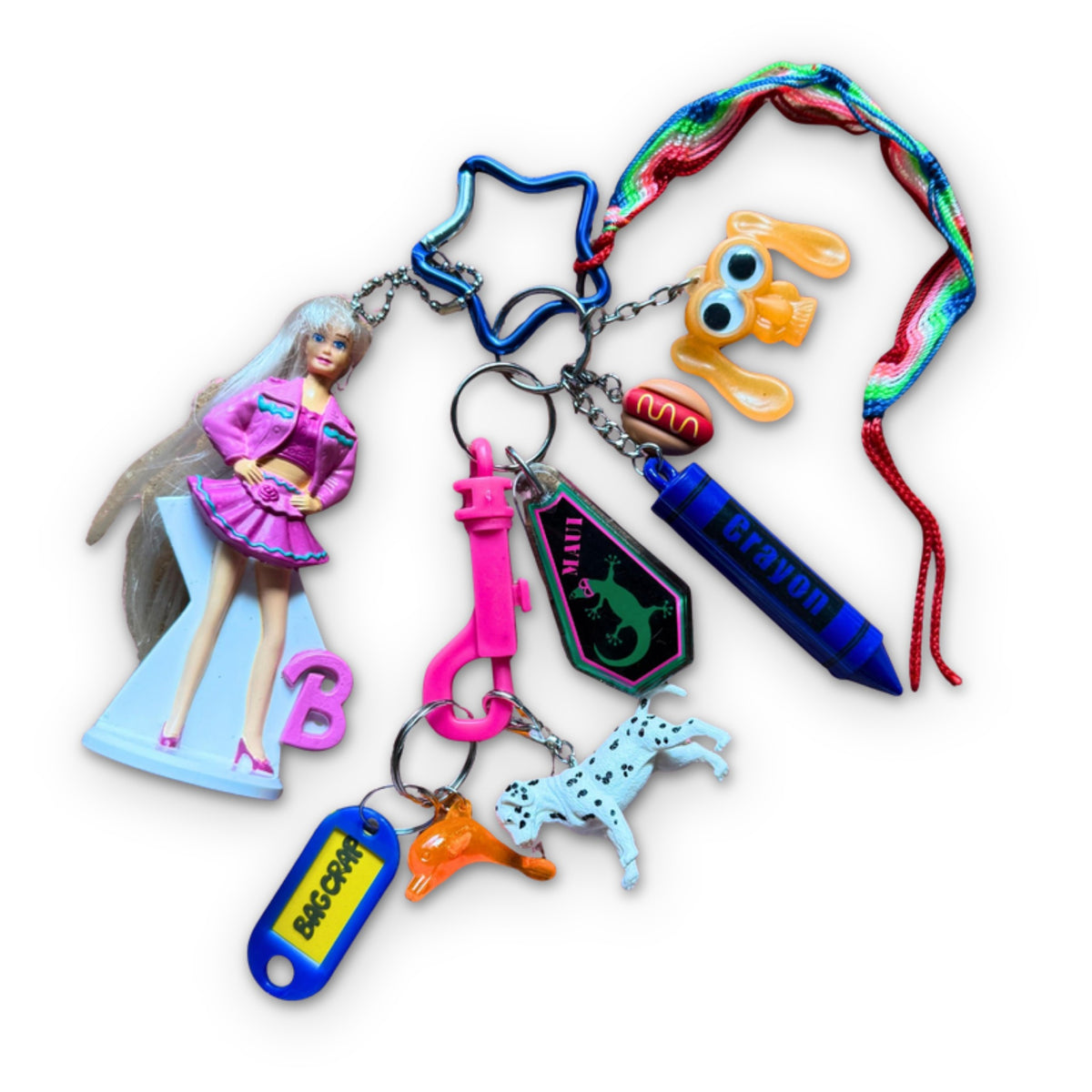 curated vintage keychains and upcycled 90s vintage toys styled into a unique 1:1 handcrafted bag charms