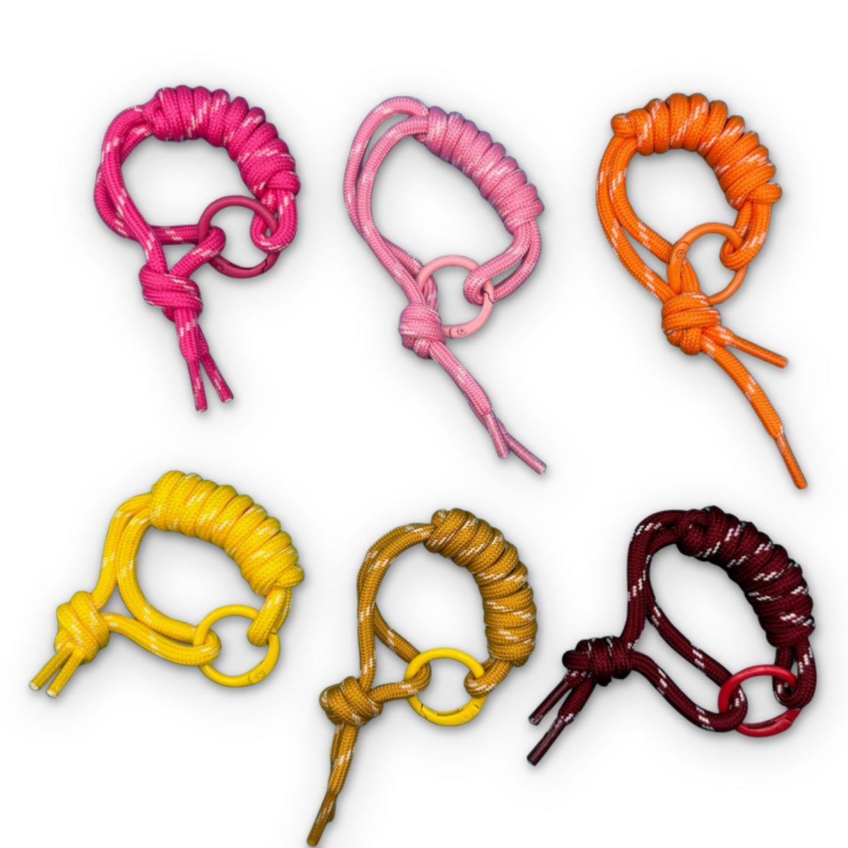 Paracord Bag Charm Handle Attachments - Pink, Yellow, Orange on a white background