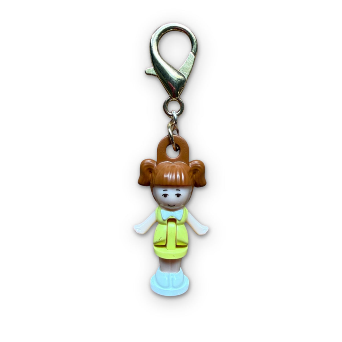 Retro Mini Brunette Polly Pocket Bag Charm on a white background