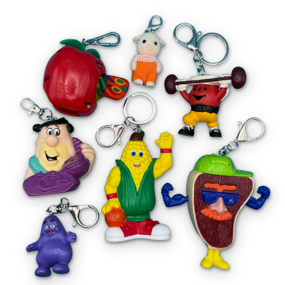 Vintage 1980s-1990s Assorted Character Bag Charms on a white background