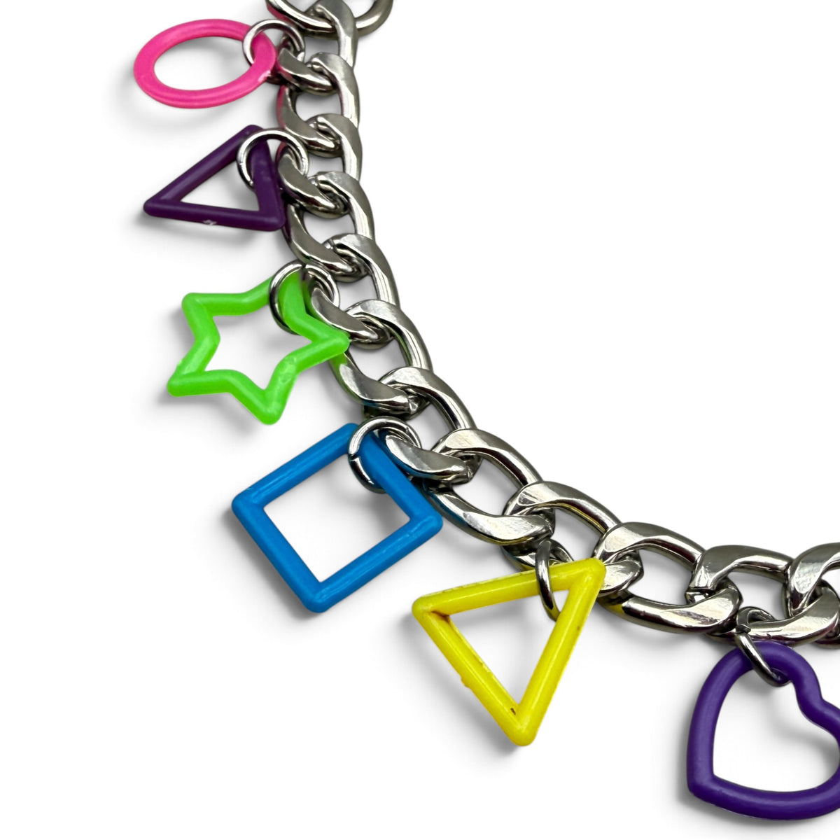Close-up of neon pink, purple, green, blue and yellow Lisa Frank plastic shapes on silver chain