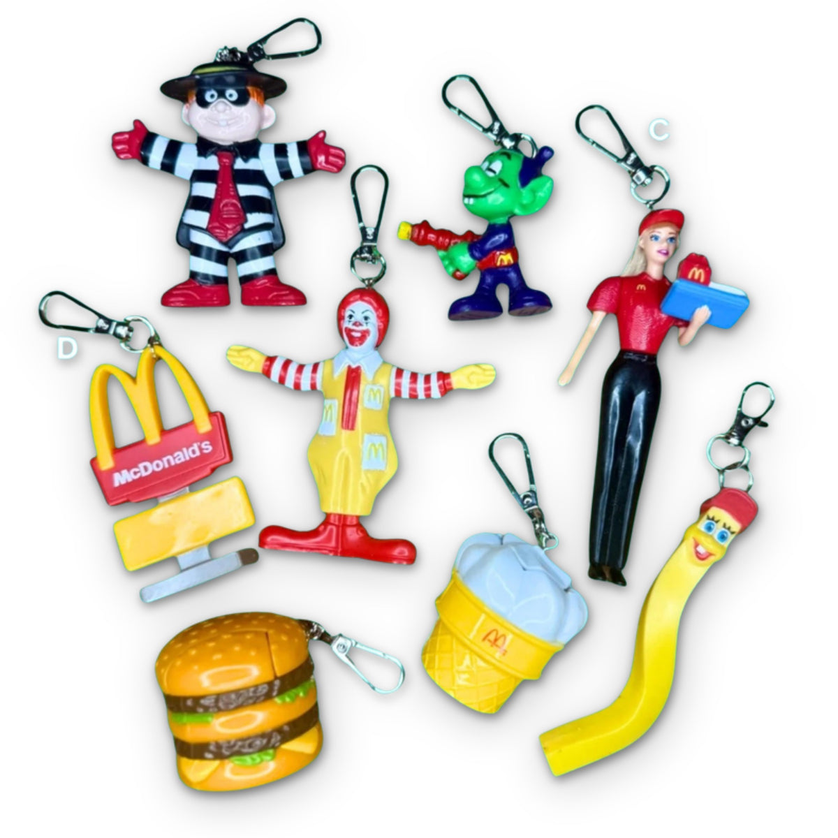 Vintage 1980s-1990s McDonald's Happy Meal Toy Bag Charms on a white background